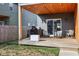 Cozy backyard patio with wood ceiling, string lights, grill, and comfortable seating, great for outdoor entertainment at 139 Mckim Ave, Indianapolis, IN 46201