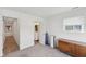 Bright bedroom features a view to a bathroom, walk-in closet, and dresser at 139 Mckim Ave, Indianapolis, IN 46201
