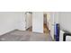 Spacious bedroom with an open bathroom doorway and closet with a sliding barn door at 139 Mckim Ave, Indianapolis, IN 46201