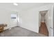 Bright, carpeted bedroom with neutral walls, and a sunlit window at 139 Mckim Ave, Indianapolis, IN 46201