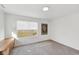 Bright bedroom with a large window offering plenty of natural light, and a neutral color palette at 139 Mckim Ave, Indianapolis, IN 46201
