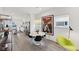 Sunlit dining room featuring a sleek marble table, contemporary decor, and easy access to the modern kitchen at 139 Mckim Ave, Indianapolis, IN 46201