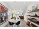 Open concept dining space with a marble table, modern light fixture, and contemporary decor accents at 139 Mckim Ave, Indianapolis, IN 46201
