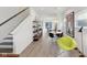 Open concept dining space with a marble table, modern light fixture, and contemporary decor accents at 139 Mckim Ave, Indianapolis, IN 46201