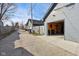 Garage with open door showing storage and tools, nestled between neighboring homes along a rear alleyway at 139 Mckim Ave, Indianapolis, IN 46201