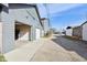 Back alley view of garage doors with an open garage revealing a bright, plywood interior at 139 Mckim Ave, Indianapolis, IN 46201
