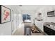 Bright kitchen with white cabinets, stainless steel appliances, and a butcher block island with a colorful rug at 139 Mckim Ave, Indianapolis, IN 46201