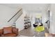 Open floorplan with hardwood floors, a living room, dining area, and modern decor, offering a seamless flow at 139 Mckim Ave, Indianapolis, IN 46201