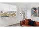 Stylish living room featuring modern decor, a cozy brown leather sofa, and abundant natural light at 139 Mckim Ave, Indianapolis, IN 46201