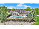 Overhead view of fenced pool area, landscaping, and community building at 13902 Rue Royale Ln # 62, McCordsville, IN 46055