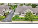 Aerial shot showing a home with manicured lawn, garden, patio, brick accents, and stone facade at 13902 Rue Royale Ln # 62, McCordsville, IN 46055