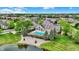 Scenic aerial of the neighborhood, community building, pool, and surrounding landscaping at 13902 Rue Royale Ln # 62, McCordsville, IN 46055
