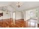 Spacious living room features hardwood floors and seamlessly connects to the dining area at 13902 Rue Royale Ln # 62, McCordsville, IN 46055