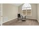 Bright office space with neutral walls, and a large window allowing for natural light at 13902 Rue Royale Ln # 62, McCordsville, IN 46055