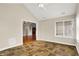 Sunroom features tile flooring, a ceiling fan, and a view of the connecting room with wood floors at 13902 Rue Royale Ln # 62, McCordsville, IN 46055