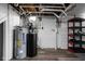 Basement utilities, featuring water heater and water softener system at 1979 W Gordon Rd, Mooresville, IN 46158