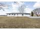 Exterior view of the house, showing the back yard, garage, and outdoor space at 1979 W Gordon Rd, Mooresville, IN 46158