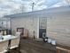 Backyard deck with a dining table and chairs, adjacent to the house with stone siding at 2104 W Barcelona Dr, Muncie, IN 47304