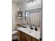 Bathroom with a modern sink, vanity, mirror, and shelving at 2104 W Barcelona Dr, Muncie, IN 47304