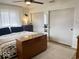 Bedroom with a white metal bed, area rug, ceiling fan, and closet at 2104 W Barcelona Dr, Muncie, IN 47304