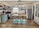 Bright kitchen with stainless steel appliances, green cabinets, butcher block countertops, and island with seating at 2104 W Barcelona Dr, Muncie, IN 47304