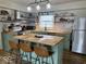 Charming kitchen with a butcher block island, stainless steel appliances, and rustic open shelving at 2104 W Barcelona Dr, Muncie, IN 47304