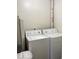 Functional laundry room with white washer and dryer at 2104 W Barcelona Dr, Muncie, IN 47304