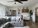 Comfortable living room featuring a gray sectional sofa, stylish accents, and plenty of natural light at 2104 W Barcelona Dr, Muncie, IN 47304
