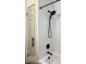 Modern bathroom shower with black hardware and white subway tile at 2104 W Barcelona Dr, Muncie, IN 47304