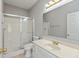 Bathroom with vanity sink, framed mirror, and glass door shower at 2218 Colfax Ln, Indianapolis, IN 46260