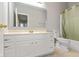 Bathroom with vanity sink, framed mirror, and toilet and tub at 2218 Colfax Ln, Indianapolis, IN 46260
