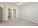 Bedroom featuring a closet, bathroom, and neutral carpet at 2218 Colfax Ln, Indianapolis, IN 46260