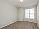 Bright bedroom featuring a window letting in natural light and plush carpeting at 2218 Colfax Ln, Indianapolis, IN 46260