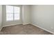Cozy bedroom with neutral carpet, and a bright window at 2218 Colfax Ln, Indianapolis, IN 46260