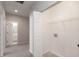 Practical walk-in closet adjacent to an open doorway and bathroom at 2218 Colfax Ln, Indianapolis, IN 46260