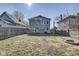 Backyard featuring an open green space, a fire pit, and a deck off of the back of the house at 2308 Nowland Ave, Indianapolis, IN 46201