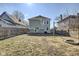 Backyard featuring an open green space, a fire pit, and a deck off of the back of the house at 2308 Nowland Ave, Indianapolis, IN 46201