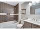 Modern bathroom featuring dark brown tile in the shower, toilet, sink and vanity at 2308 Nowland Ave, Indianapolis, IN 46201