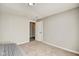 Neutral bedroom shows plush carpet, light colored walls, and an open doorway at 2308 Nowland Ave, Indianapolis, IN 46201