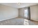 Neutral bedroom featuring carpet, window with curtain, and good natural light at 2308 Nowland Ave, Indianapolis, IN 46201