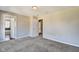 Neutral bedroom features two doors, carpeted floors, and light-colored walls at 2308 Nowland Ave, Indianapolis, IN 46201