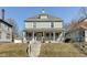 Charming two-story home featuring a large, inviting front porch with classic architectural details at 2308 Nowland Ave, Indianapolis, IN 46201