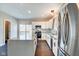 Bright kitchen with island, stainless appliances, and a view to the deck at 2308 Nowland Ave, Indianapolis, IN 46201