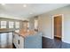 Open kitchen island with seating overlooking entry and living areas at 2308 Nowland Ave, Indianapolis, IN 46201
