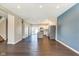 Bright, open-concept living space featuring sleek hardwood floors, a modern kitchen, and recessed lighting at 2308 Nowland Ave, Indianapolis, IN 46201