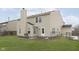 Spacious backyard boasts green grass, a patio, and a fence, perfect for outdoor entertaining and recreation at 3113 Cassara Dr, Indianapolis, IN 46203