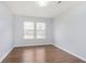 Bedroom showcasing wood floors and natural light from two windows at 3113 Cassara Dr, Indianapolis, IN 46203