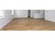 An empty living room featuring wood-look flooring and a window with natural light at 3113 Cassara Dr, Indianapolis, IN 46203