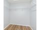 A walk-in closet with white wire racks and wood-look flooring at 3113 Cassara Dr, Indianapolis, IN 46203