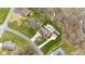 Aerial view of a traditional home with a pool, a pool house, and a large, treed lot at 34 Gettysburg, Coatesville, IN 46121